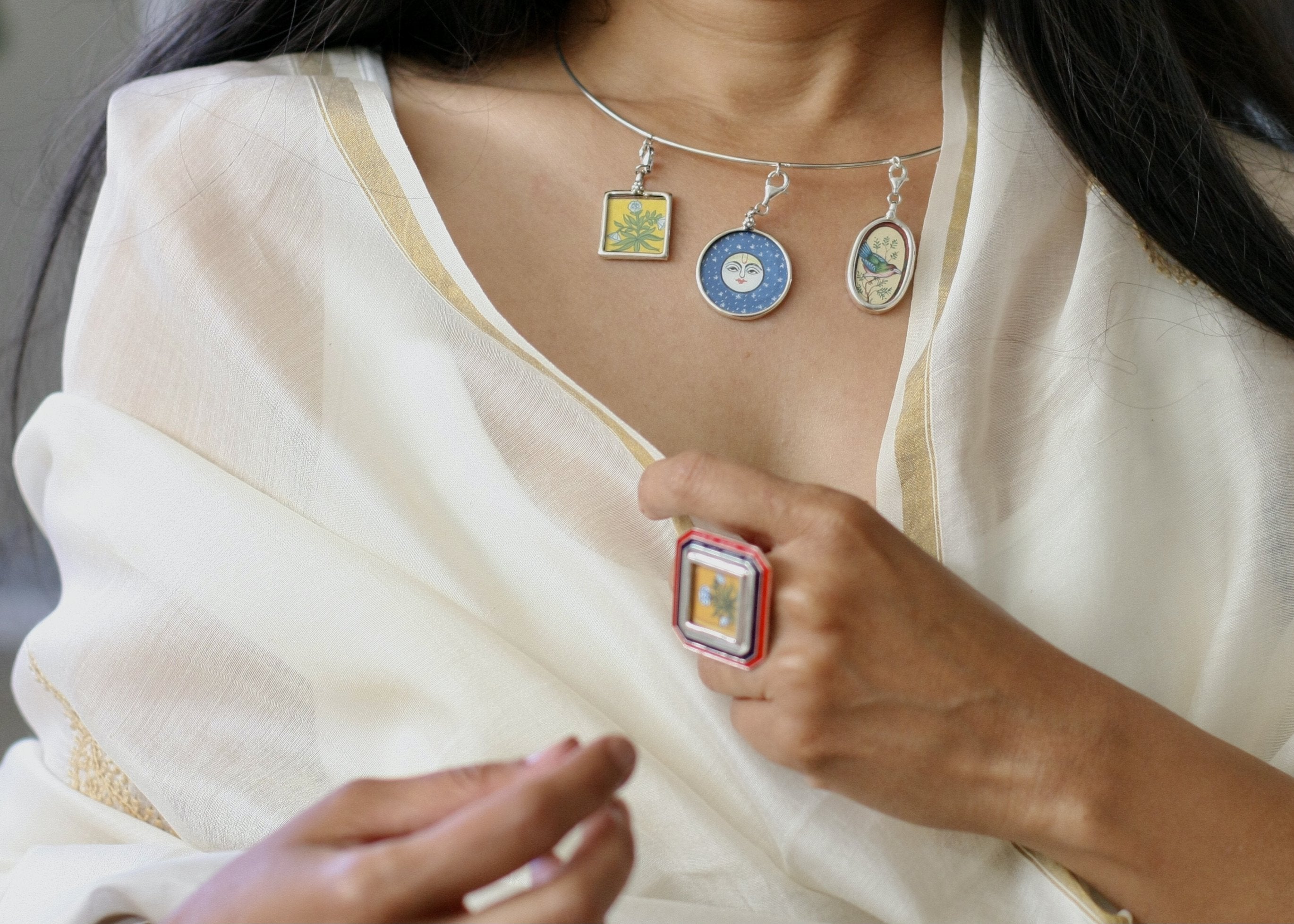 Story-rich, head-turning, hasli (neck ring) with miniature painting pendants - Craft Stories